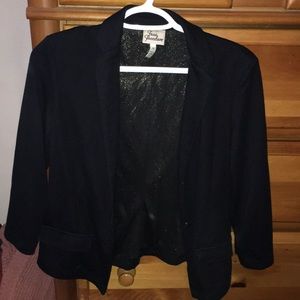 Black blazer with gold sparkles lining the inside